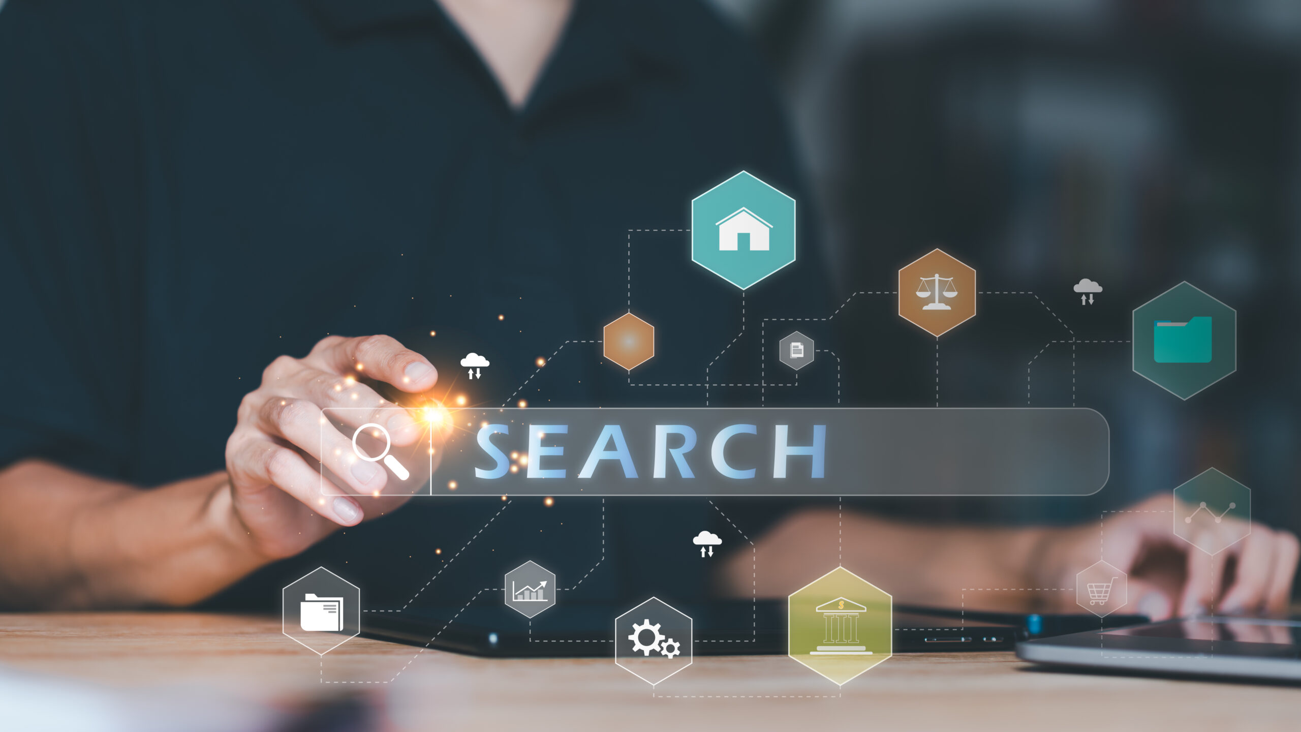 A person pointing towards a search bar with SEO icons surrounding it.